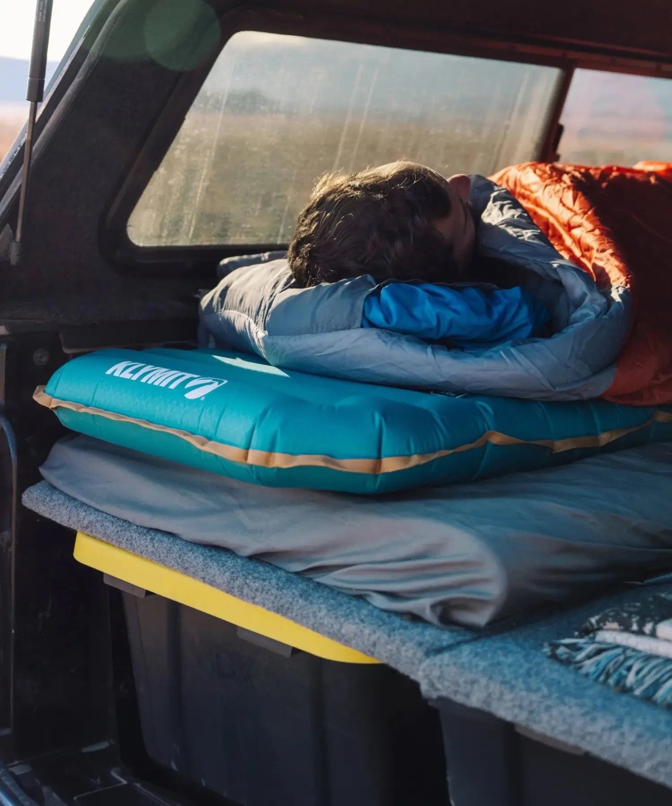 Klymit Klymaloft sleeping pad in truck bed for overland camping